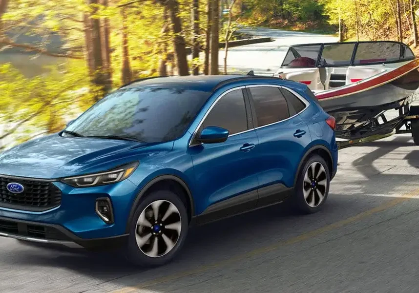 25Ford-Escape-ExteriorOnForestRoadTowingBoat-21x9